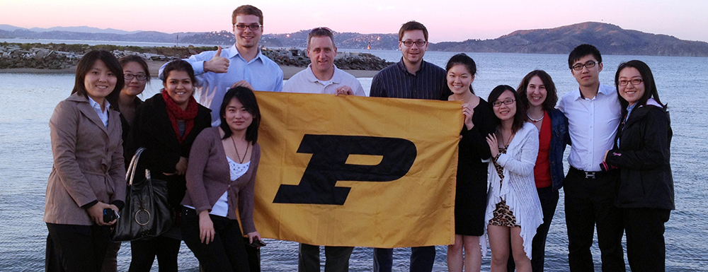 Students holding Purdue flag
