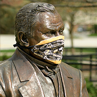 John Purdue statue with facemask
