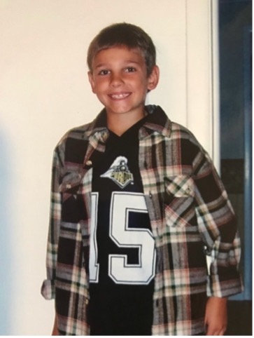 Mitchell as a young child in his Drew Brees signed jersey 